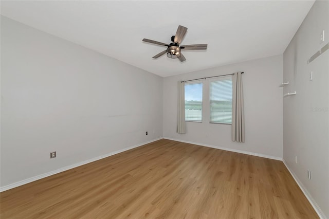 empty room featuring ceiling fan and light wood-type flooring