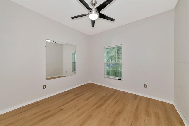 unfurnished room with light wood-type flooring and ceiling fan