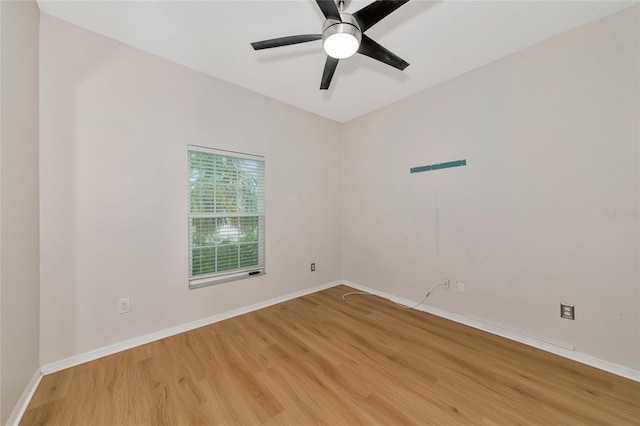 empty room featuring hardwood / wood-style flooring and ceiling fan