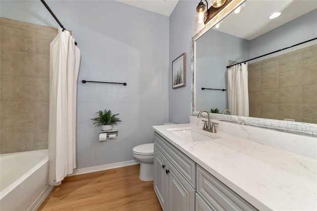 full bathroom with toilet, shower / bath combo, vanity, and hardwood / wood-style floors