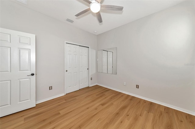 unfurnished bedroom with light hardwood / wood-style flooring and ceiling fan