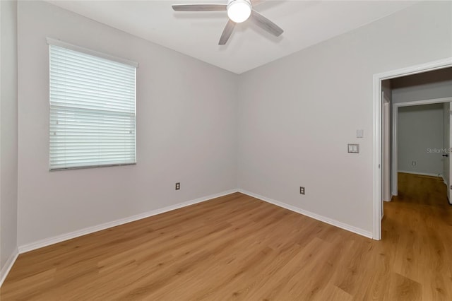 unfurnished room featuring ceiling fan and light hardwood / wood-style flooring