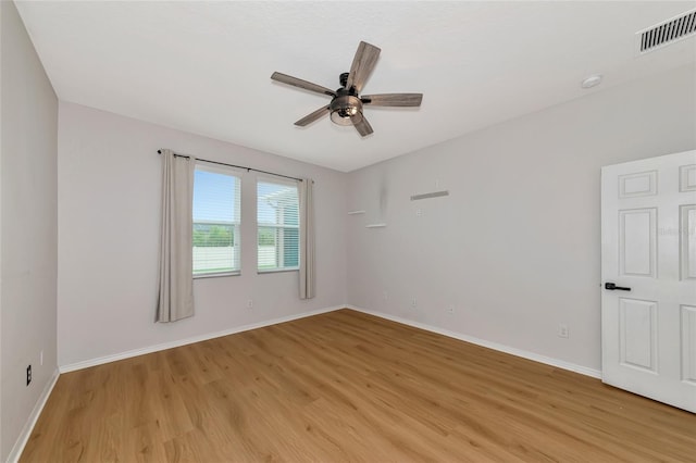 spare room with light hardwood / wood-style flooring and ceiling fan