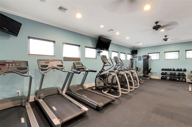 exercise room with crown molding, a healthy amount of sunlight, and ceiling fan