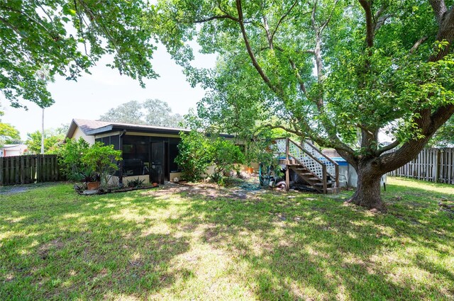 view of yard featuring a sunroom