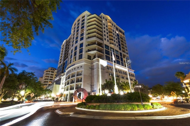 view of outdoor building at dusk