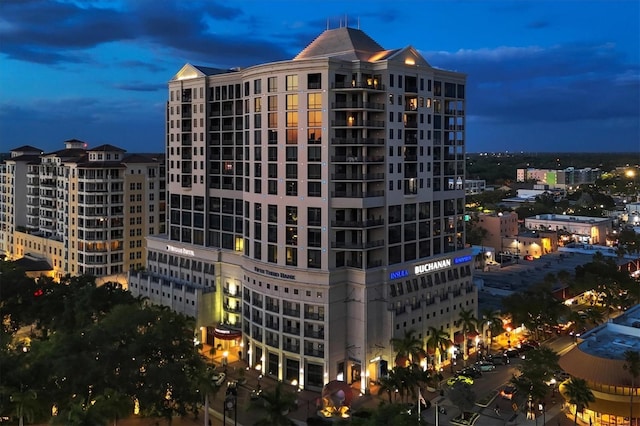 view of outdoor building at dusk