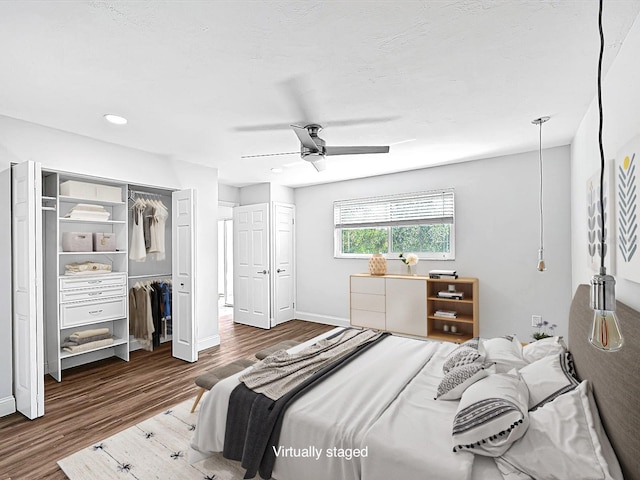 bedroom featuring hardwood / wood-style floors and ceiling fan