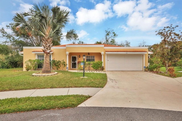 mediterranean / spanish-style house with a front lawn and a garage