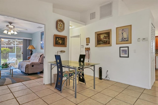 dining area featuring ceiling fan and light tile patterned floors