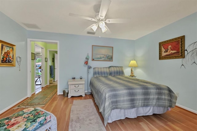 bedroom featuring ceiling fan and light hardwood / wood-style flooring