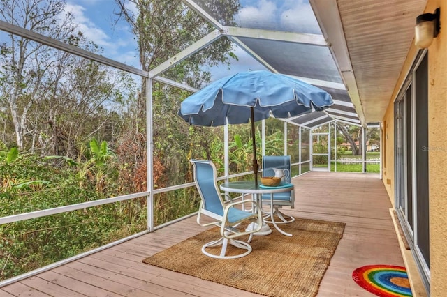 unfurnished sunroom with lofted ceiling