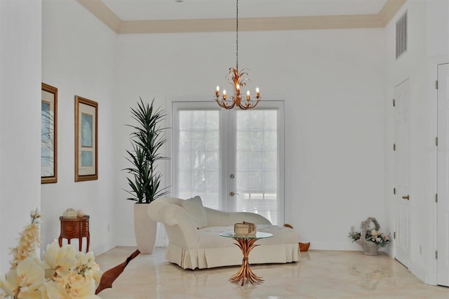 living area with a notable chandelier, crown molding, and french doors