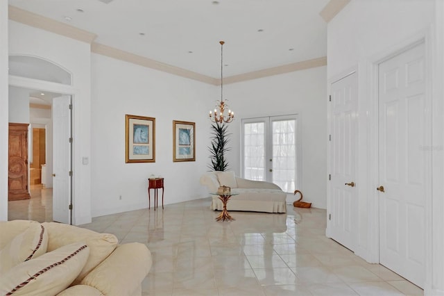 living room with french doors, light tile patterned floors, ornamental molding, and a notable chandelier