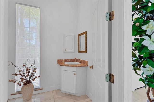 bathroom featuring tile patterned flooring and vanity