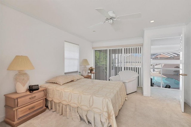 bedroom with ceiling fan, access to exterior, ornamental molding, and light carpet