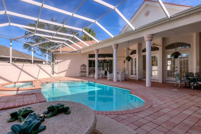 view of pool with ceiling fan, a patio, and french doors