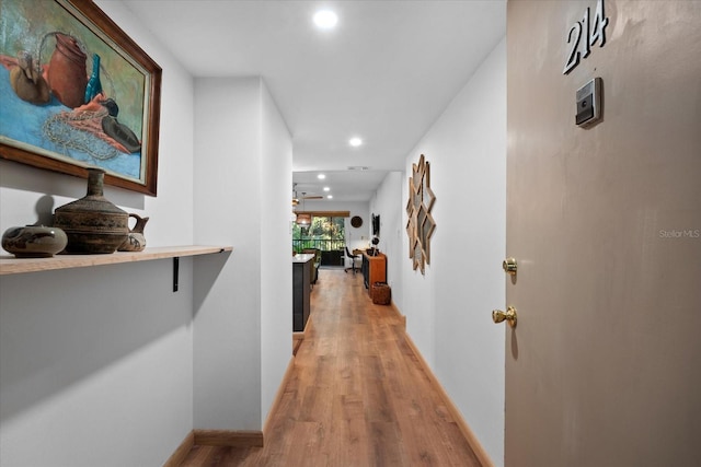 3700 S Osprey Ave Unit 214, Sarasota, FL 34239 - corridor featuring light wood-style floors, recessed lighting, and baseboards