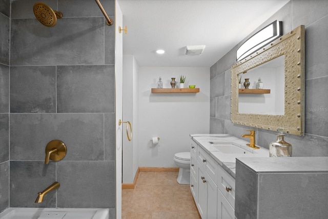 bathroom with tile patterned flooring, vanity, toilet, and a shower