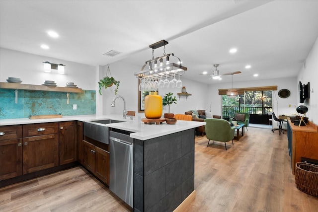 3700 S Osprey Ave Unit 214, Sarasota, FL 34239 - kitchen with dishwasher, light countertops, a sink, recessed lighting, and a peninsula