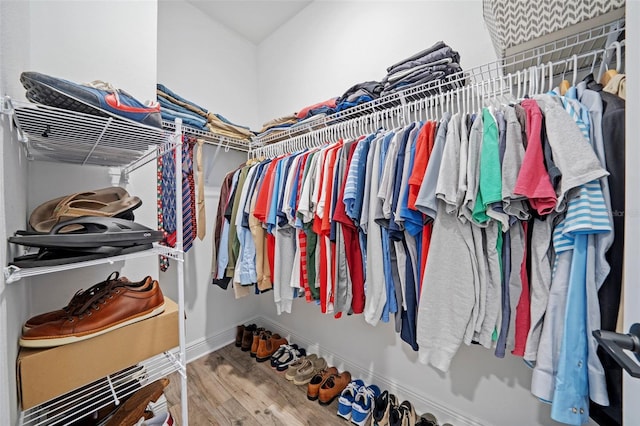 spacious closet featuring hardwood / wood-style floors