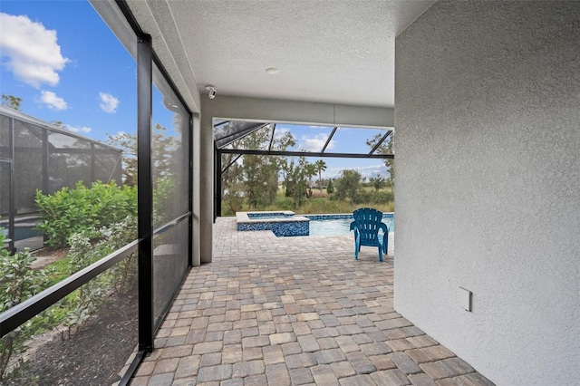 unfurnished sunroom with a pool