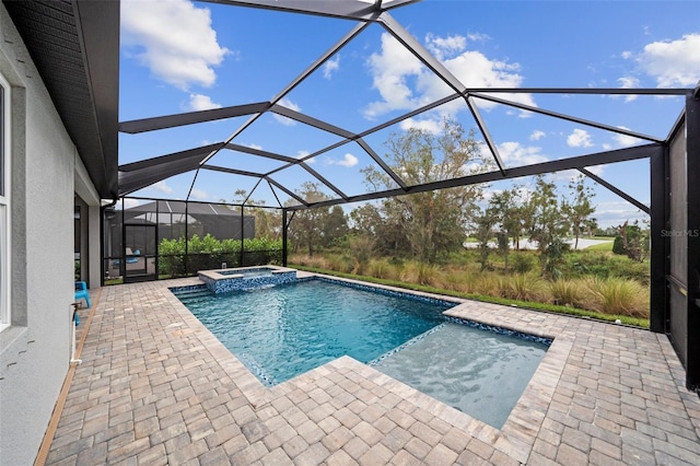 view of swimming pool with a lanai, an in ground hot tub, and a patio