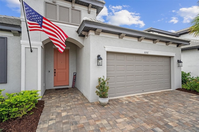 entrance to property featuring a garage