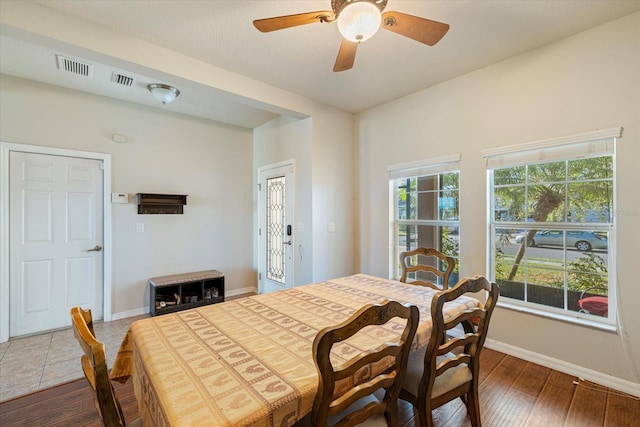 dining space featuring dark hardwood / wood-style floors and ceiling fan