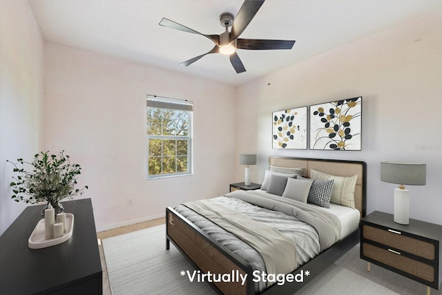 bedroom featuring ceiling fan and light hardwood / wood-style flooring