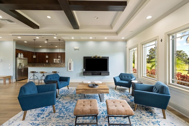 living room featuring coffered ceiling, crown molding, light hardwood / wood-style floors, and beam ceiling