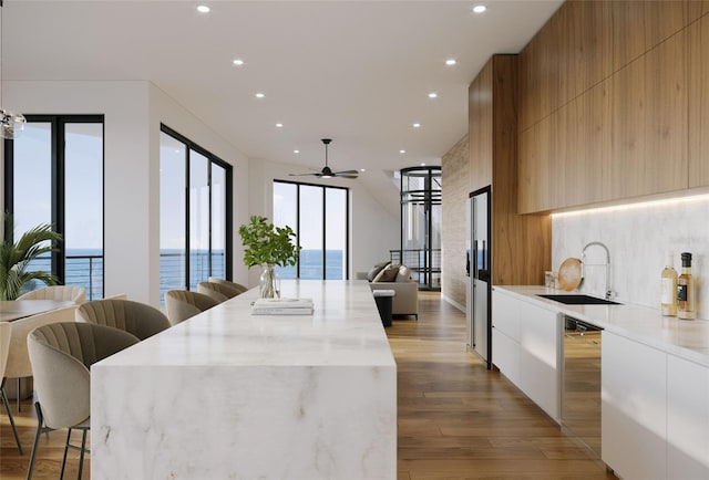 3200 Higel Ave, Sarasota, FL 34242 - kitchen with modern cabinets, a ceiling fan, and recessed lighting