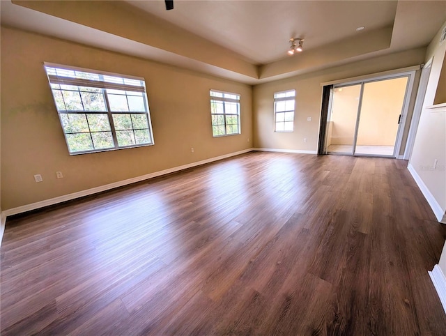 unfurnished room featuring dark wood-type flooring