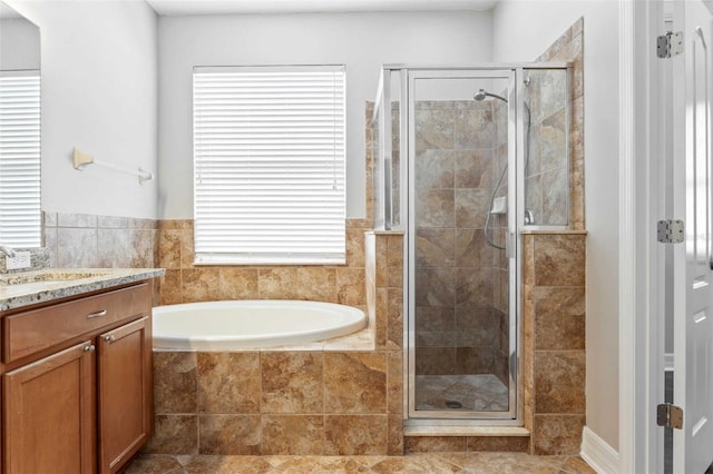 bathroom featuring vanity, tile patterned floors, and independent shower and bath