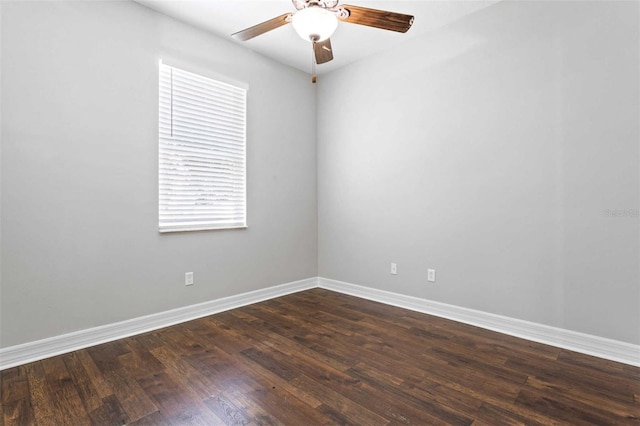 empty room with dark hardwood / wood-style flooring and ceiling fan