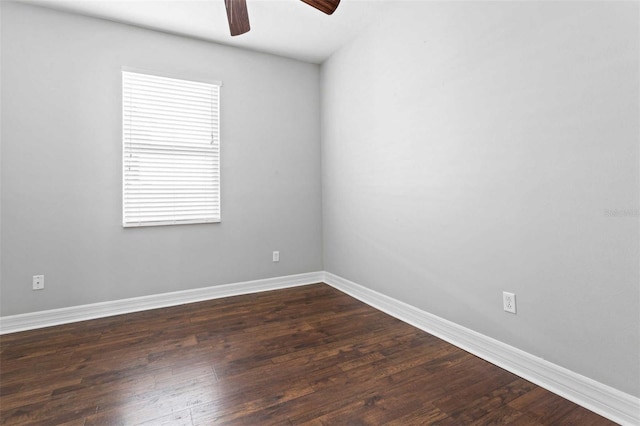 empty room with ceiling fan and dark hardwood / wood-style floors