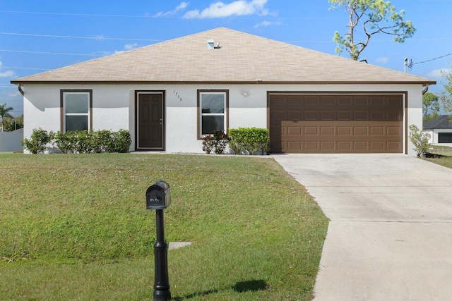 ranch-style house with a garage and a front lawn