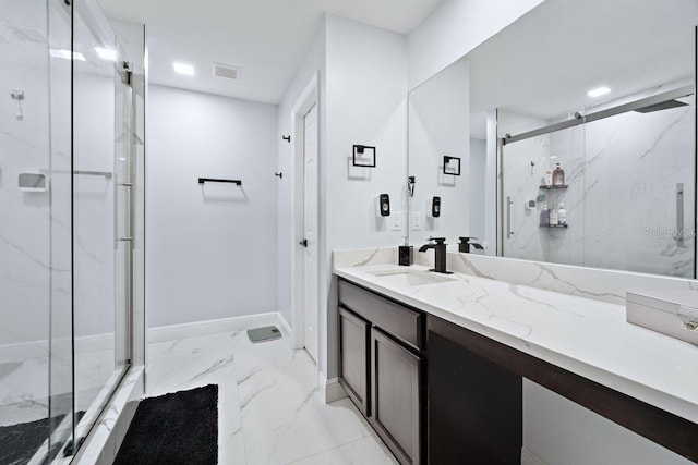 bathroom featuring vanity and an enclosed shower