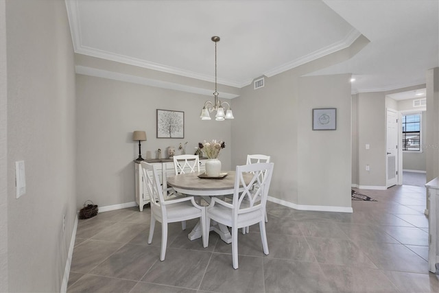 tiled dining area featuring a chandelier and ornamental molding