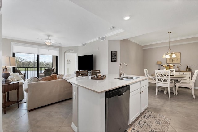 kitchen featuring a center island with sink, dishwasher, white cabinets, sink, and pendant lighting