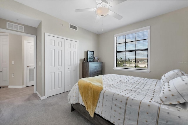 carpeted bedroom with a closet and ceiling fan