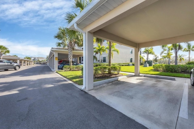 exterior space with a carport