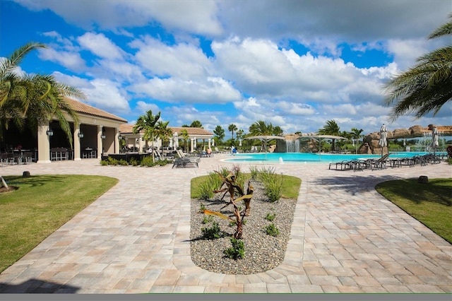 view of swimming pool featuring a patio