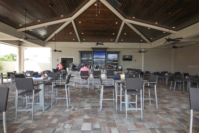 dining area featuring wooden ceiling, beamed ceiling, and high vaulted ceiling