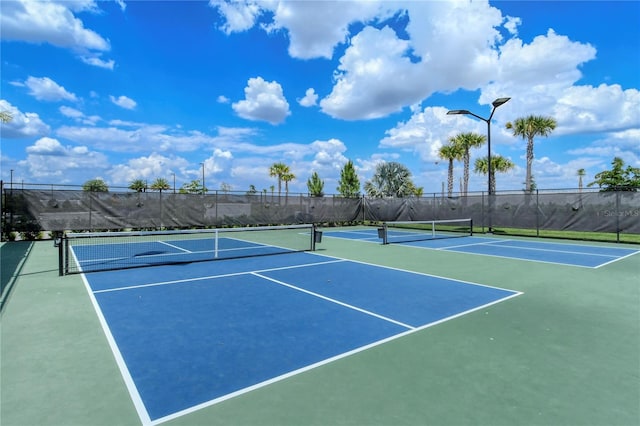 view of tennis court featuring basketball court