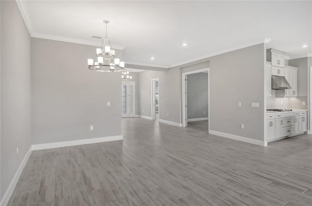 15625 San Lazzaro Ave, Bradenton, FL 34211 - spare room featuring ornamental molding, a chandelier, light wood-style floors, and recessed lighting