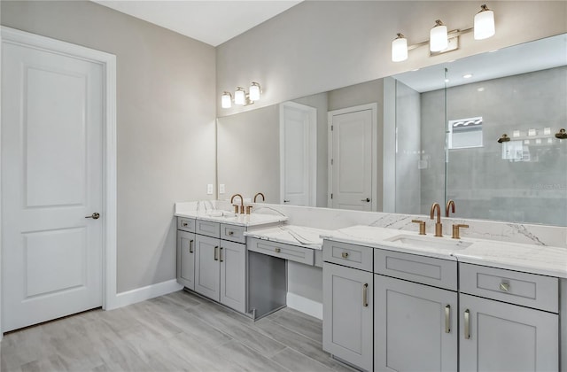 bathroom featuring vanity, a shower with shower door, and wood-type flooring