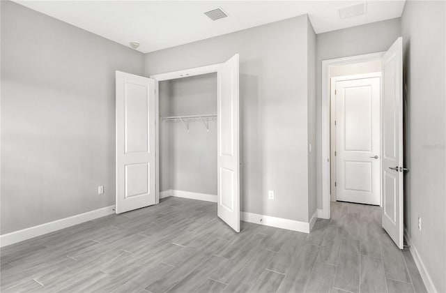 unfurnished bedroom featuring a closet