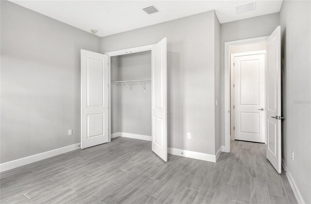 15625 San Lazzaro Ave, Bradenton, FL 34211 - unfurnished bedroom with light wood-style floors and a closet