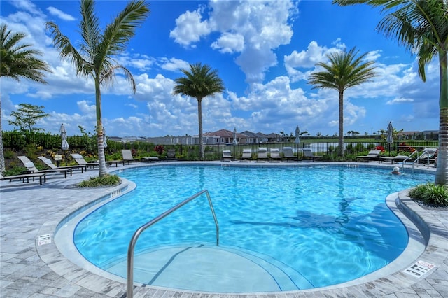 view of swimming pool with a patio